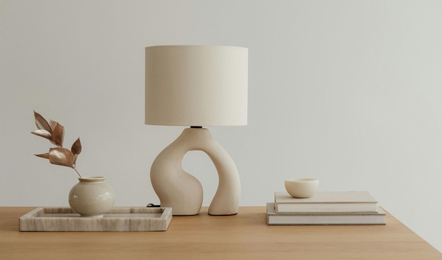Find your perfect fit at 46 Flats a lamp, stack of books, and decor