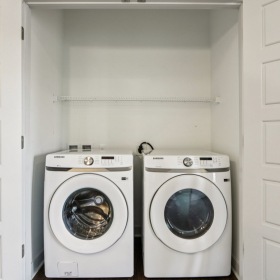 Walk in laundryrooom with washer and dryer