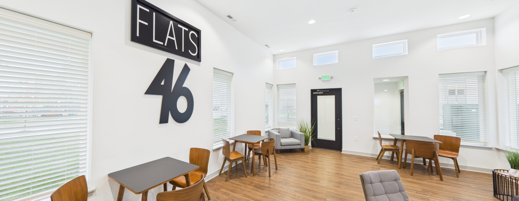 Clubhouse with furniture and wall sign