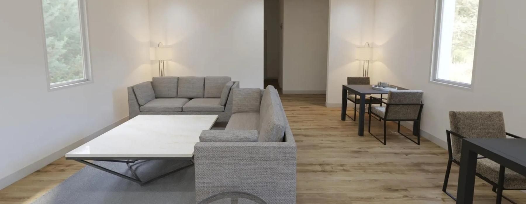 a living room with a couches and a table and dining table