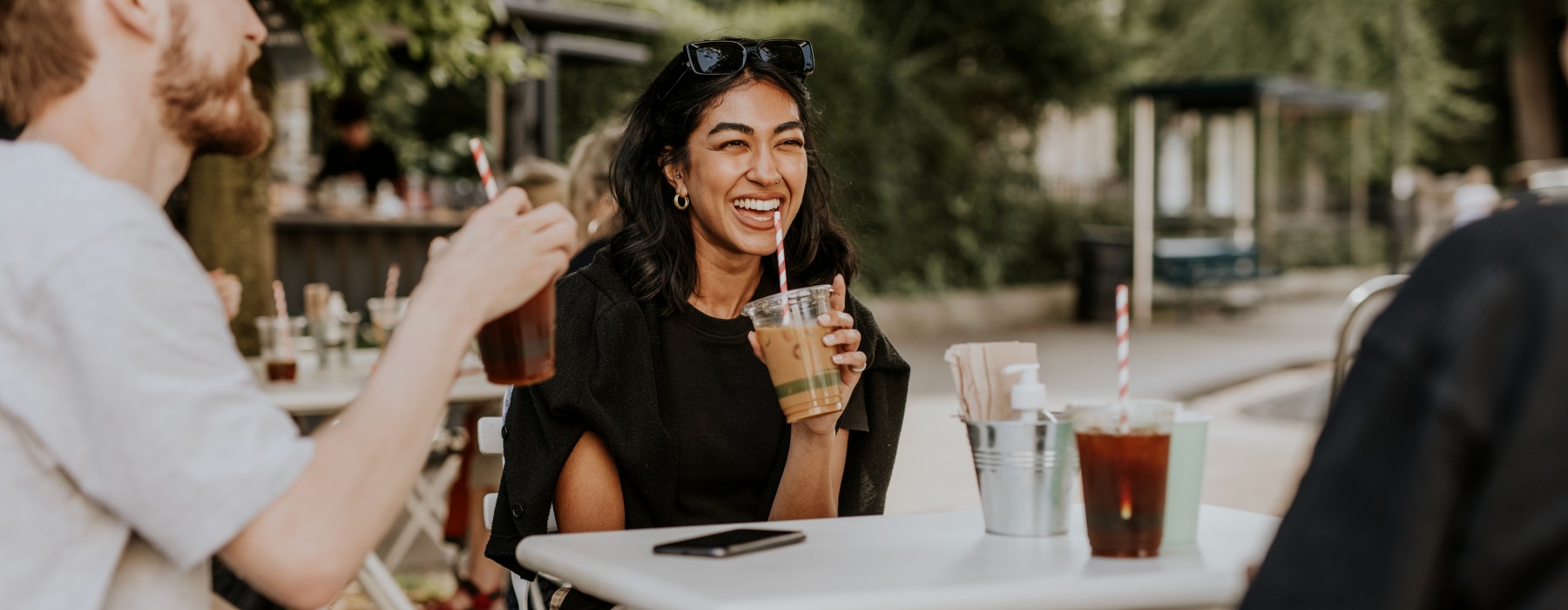 Friends at a table drinking coffee